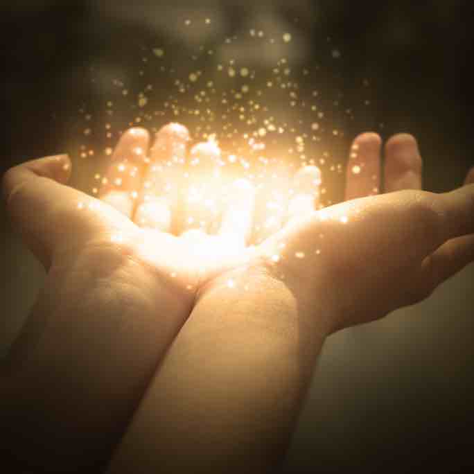 magic particles on the palms of a woman, a stream of magical energy emanating from female hands